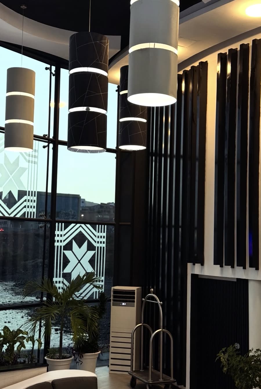Hotel VIP Praia lobby with pendant lights and sea view
